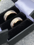 Binnenring roodgoud, buitenring witgoud, 1 diamantje